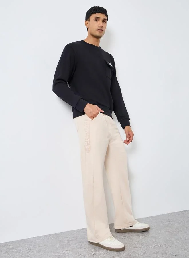 Men Beige Solid Embossed Joggers